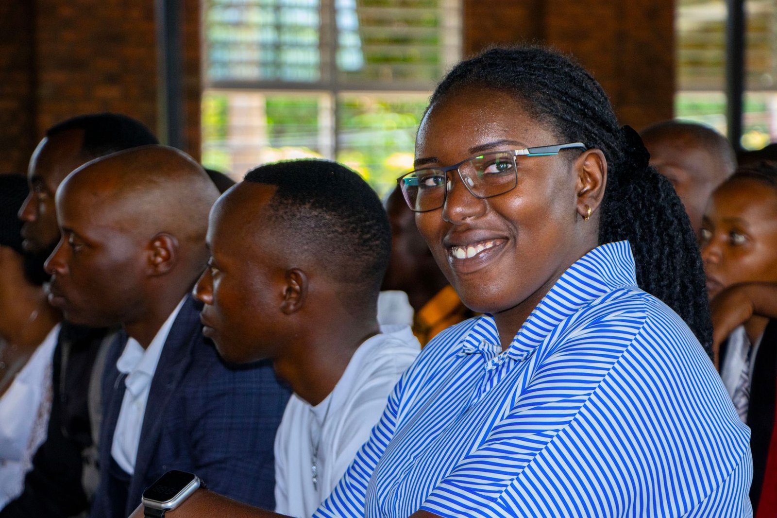 A diverse group of individuals participating in a community event focused on public education and awareness. — education…