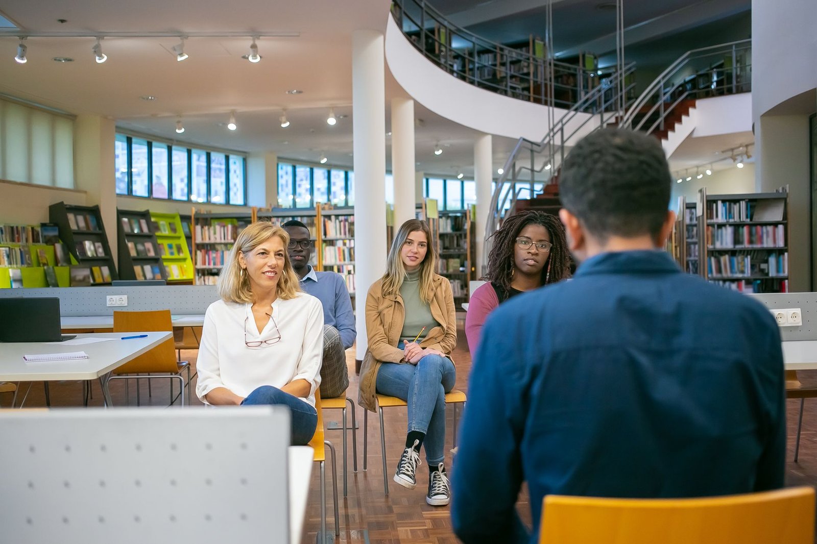 A diverse group of people engaged in a discussion about free speech. — freedom of speech