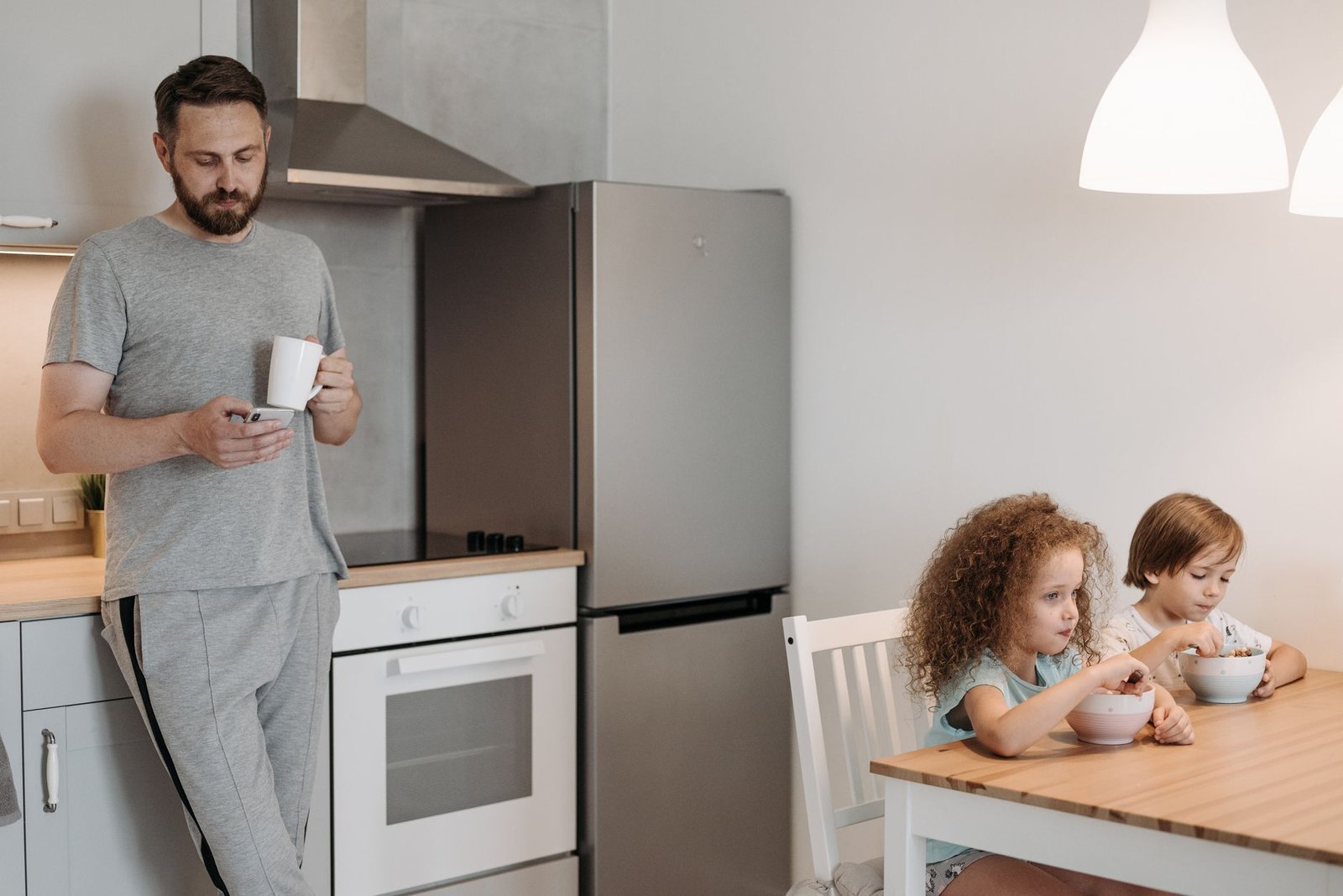 A family using energy-efficient appliances at home as part of their commitment to climate change action.