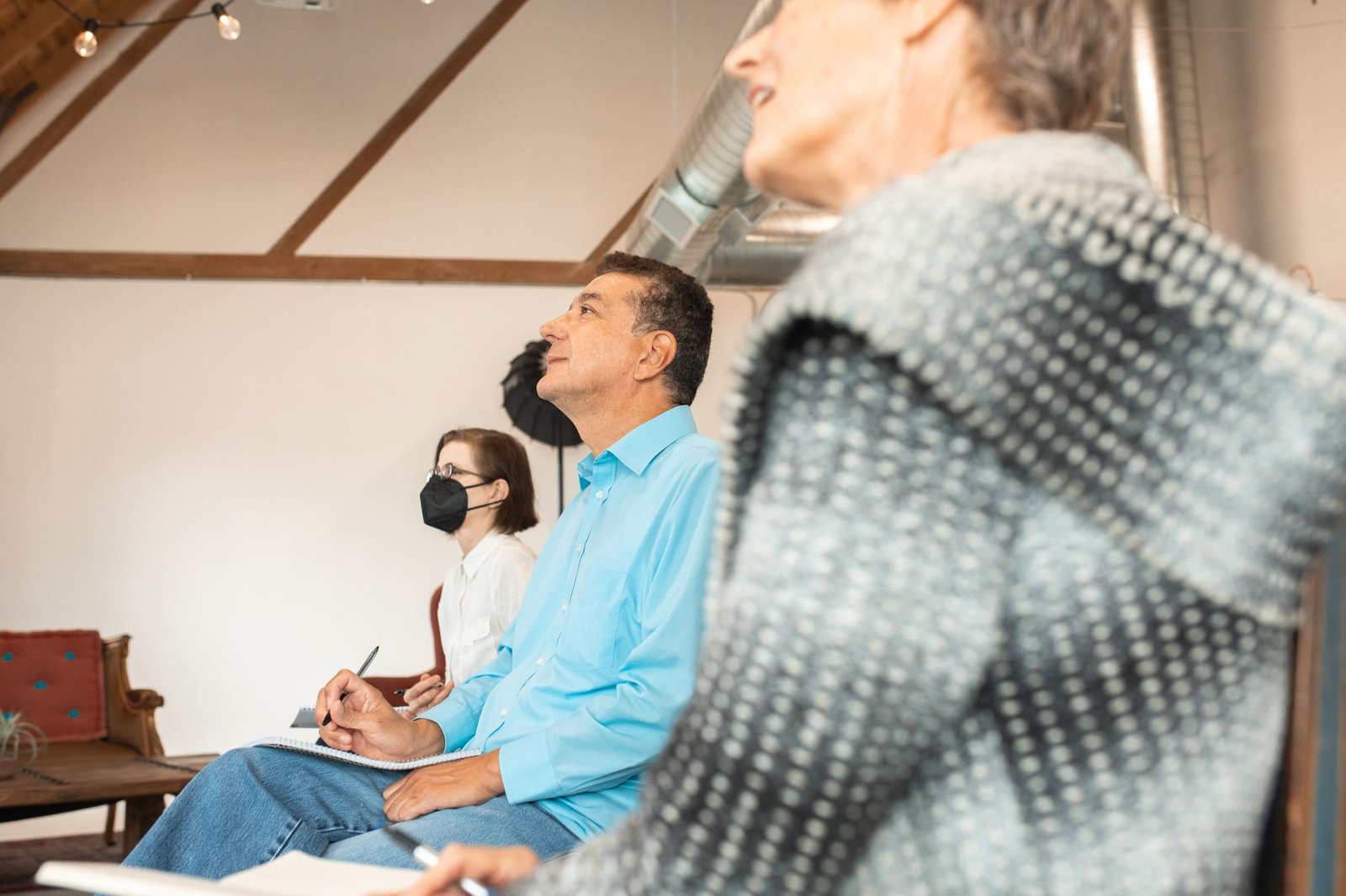 A group of professionals participating in a workshop focused on enhancing debate skills and teamwork. — professional deb…