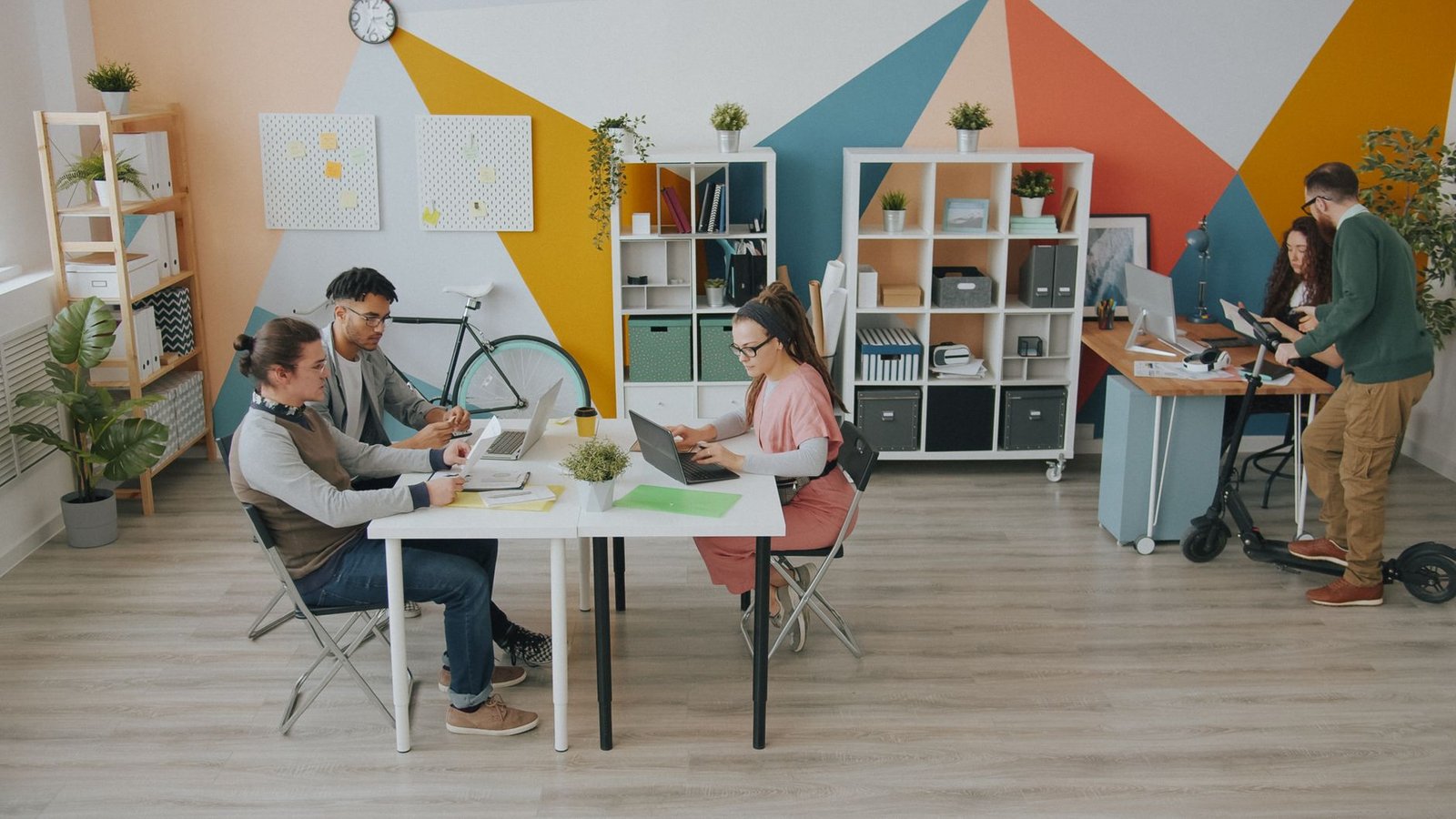 A photo depicting a collaborative workspace with AI technology in use. — AI debate