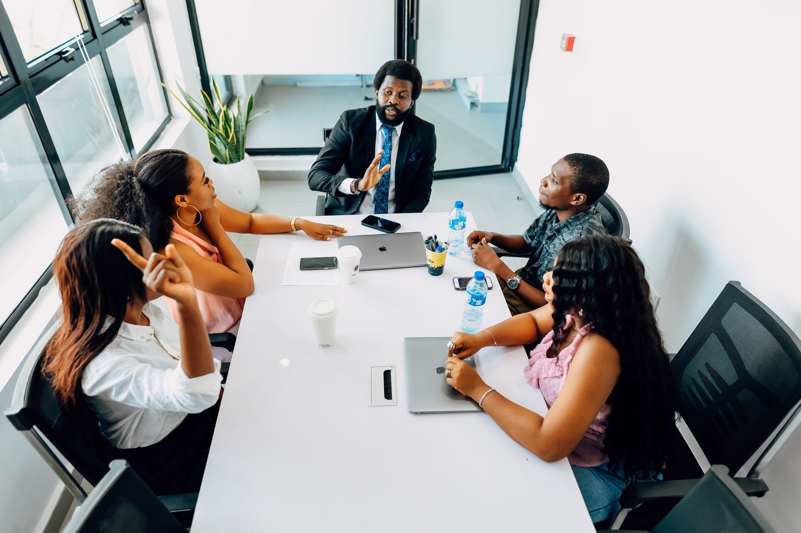 A photo of a diverse team collaborating on AI projects, emphasizing the importance of stakeholder engagement. — AI ethics
