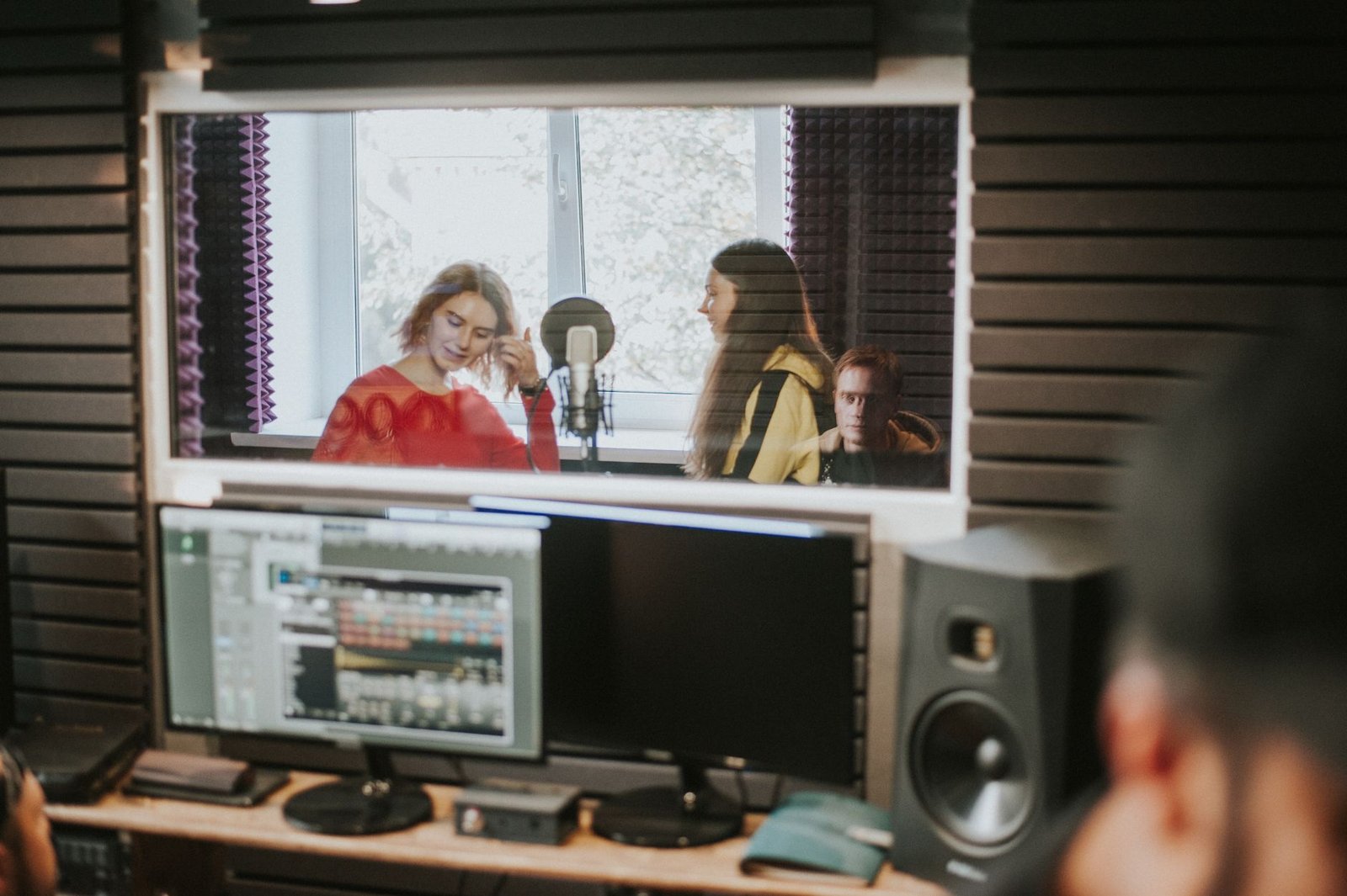 A photo of a speaker practicing their delivery in front of a mirror or peers, conveying the importance of rehearsal. — d…