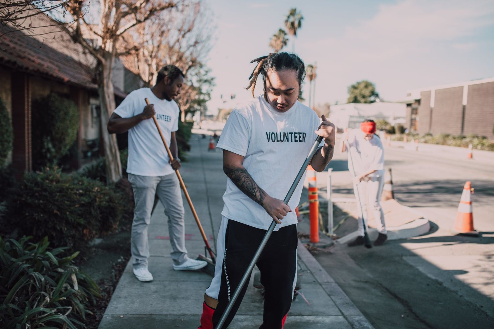 A photo of individuals participating in a community cleanup for sustainability — climate change debate