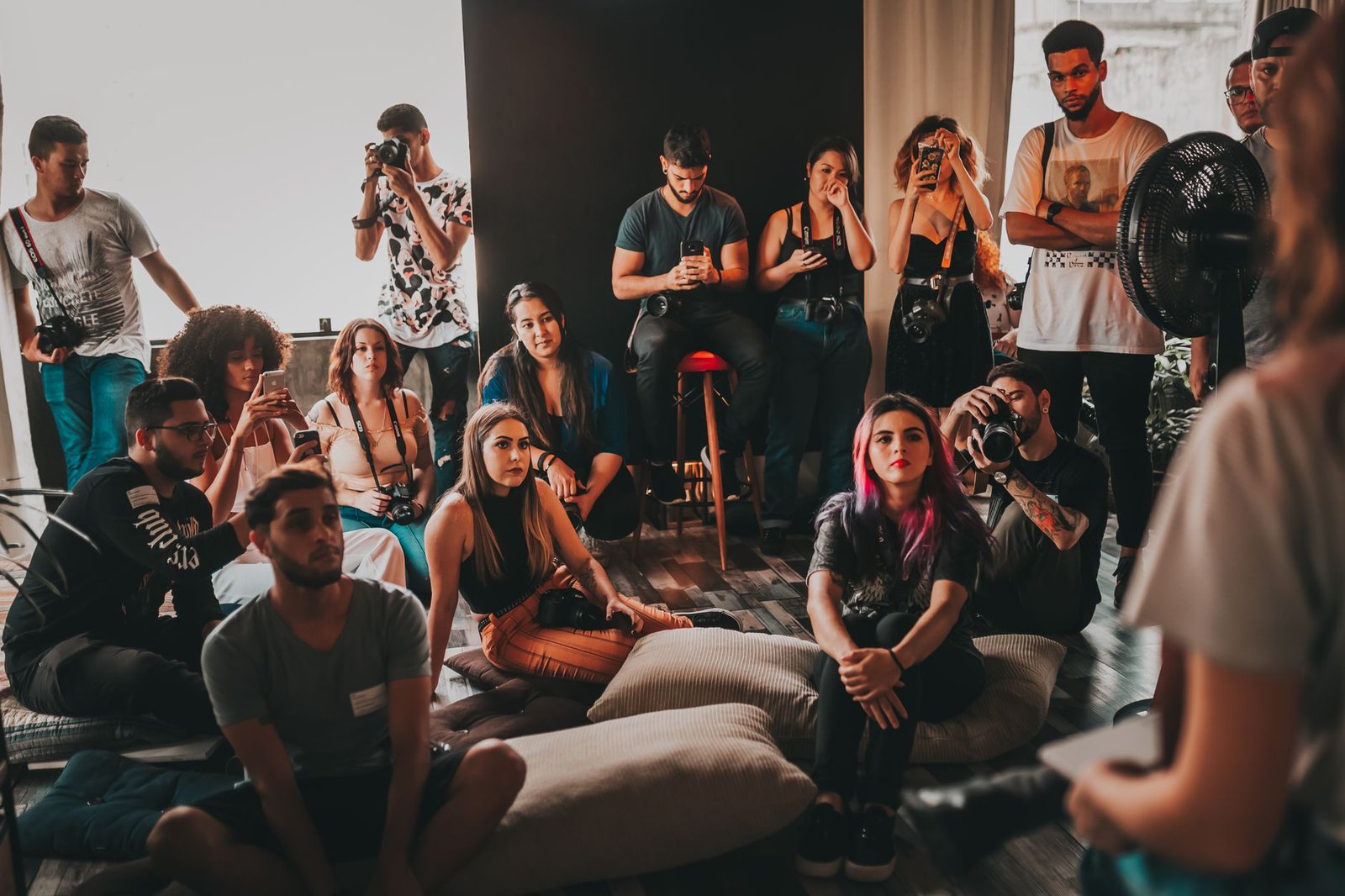 A photograph of a group of people engaged in a lively discussion about ethical issues. — ethical dilemmas debate