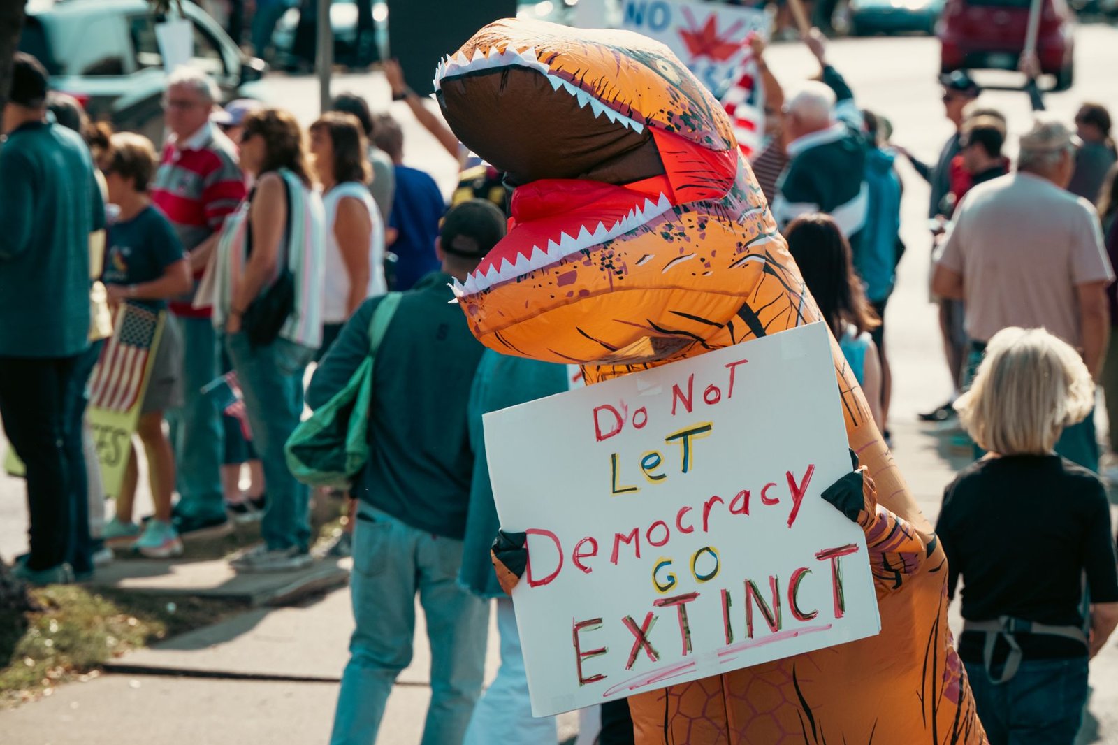 A protest sign advocating for freedom of speech at a rally. — censorship debate