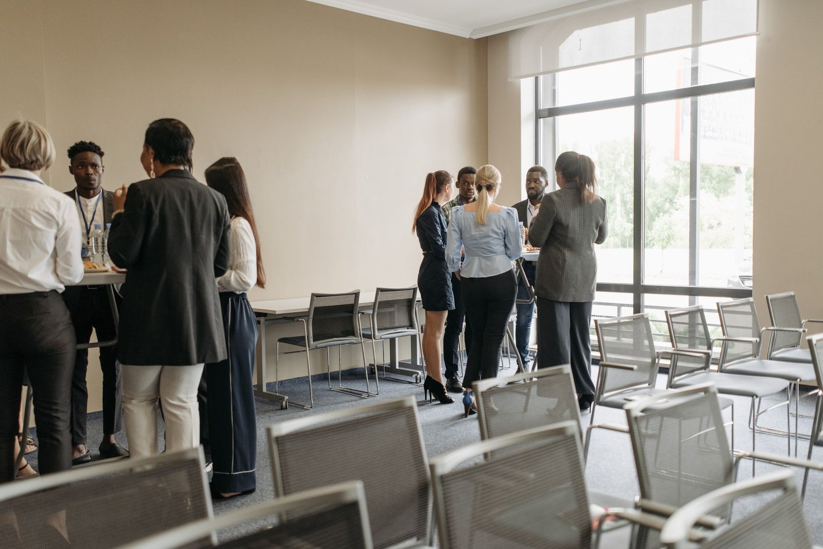An image showing a diverse group of professionals engaged in a debate during a meeting. — business debating skills