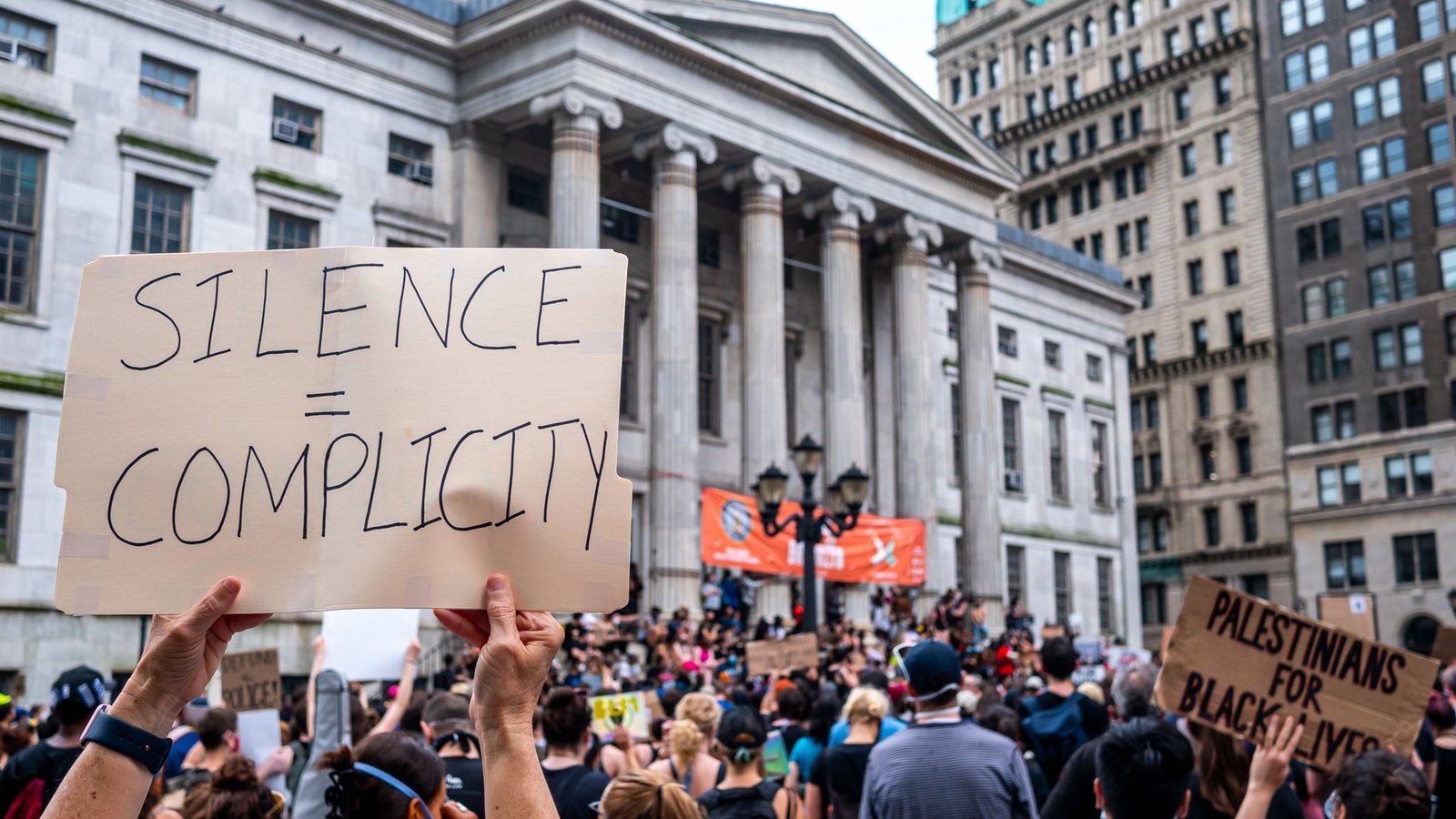 Image of a protest rally advocating for gun control with diverse participants. — gun control debate