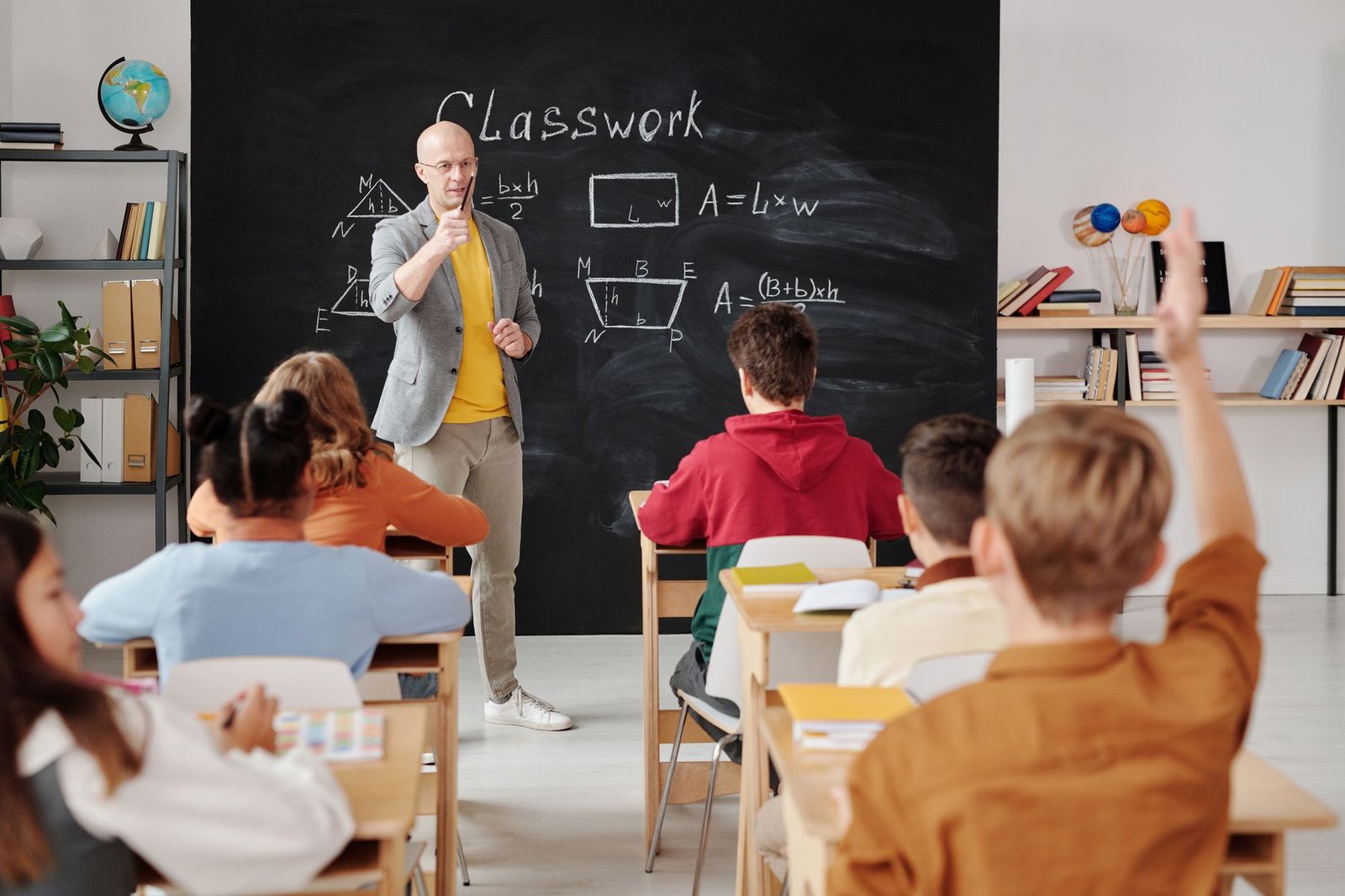 A chalkboard or flip chart filled with creative debate questions.