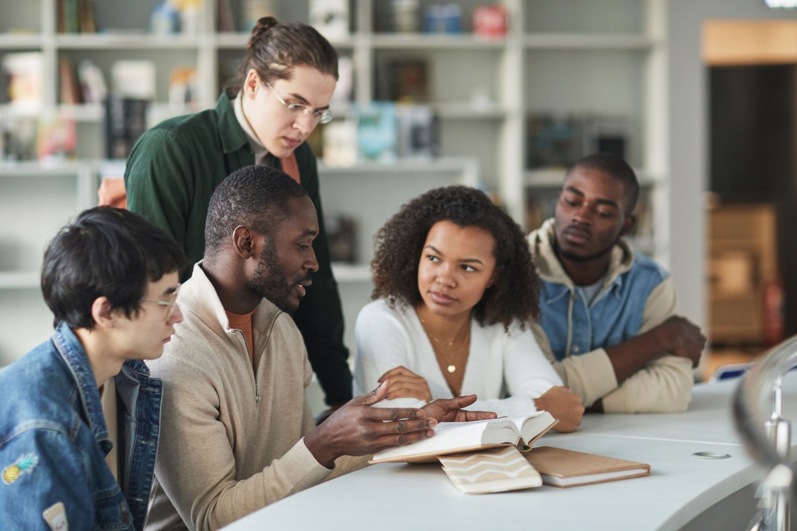 A diverse group of Gen Z individuals engaging in political discussions at a community event. — Gen Z politics