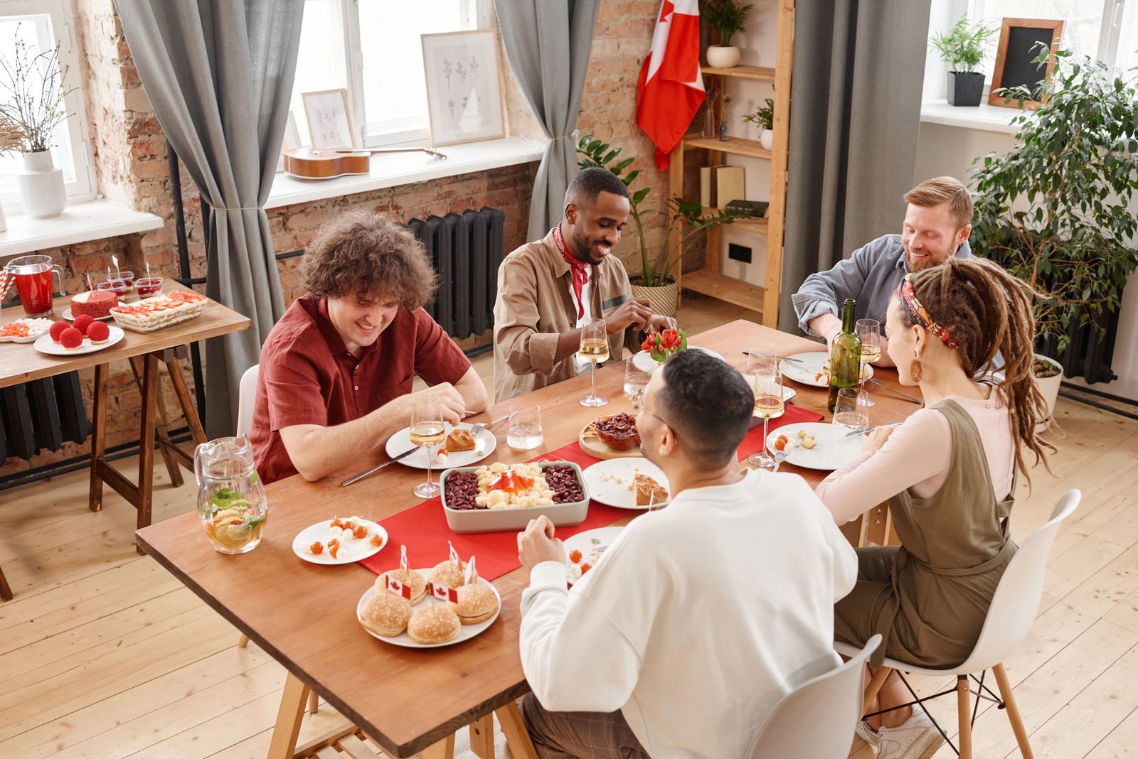 A diverse group of people enjoying a vegan meal together, emphasizing community and inclusivity. — veganism debate