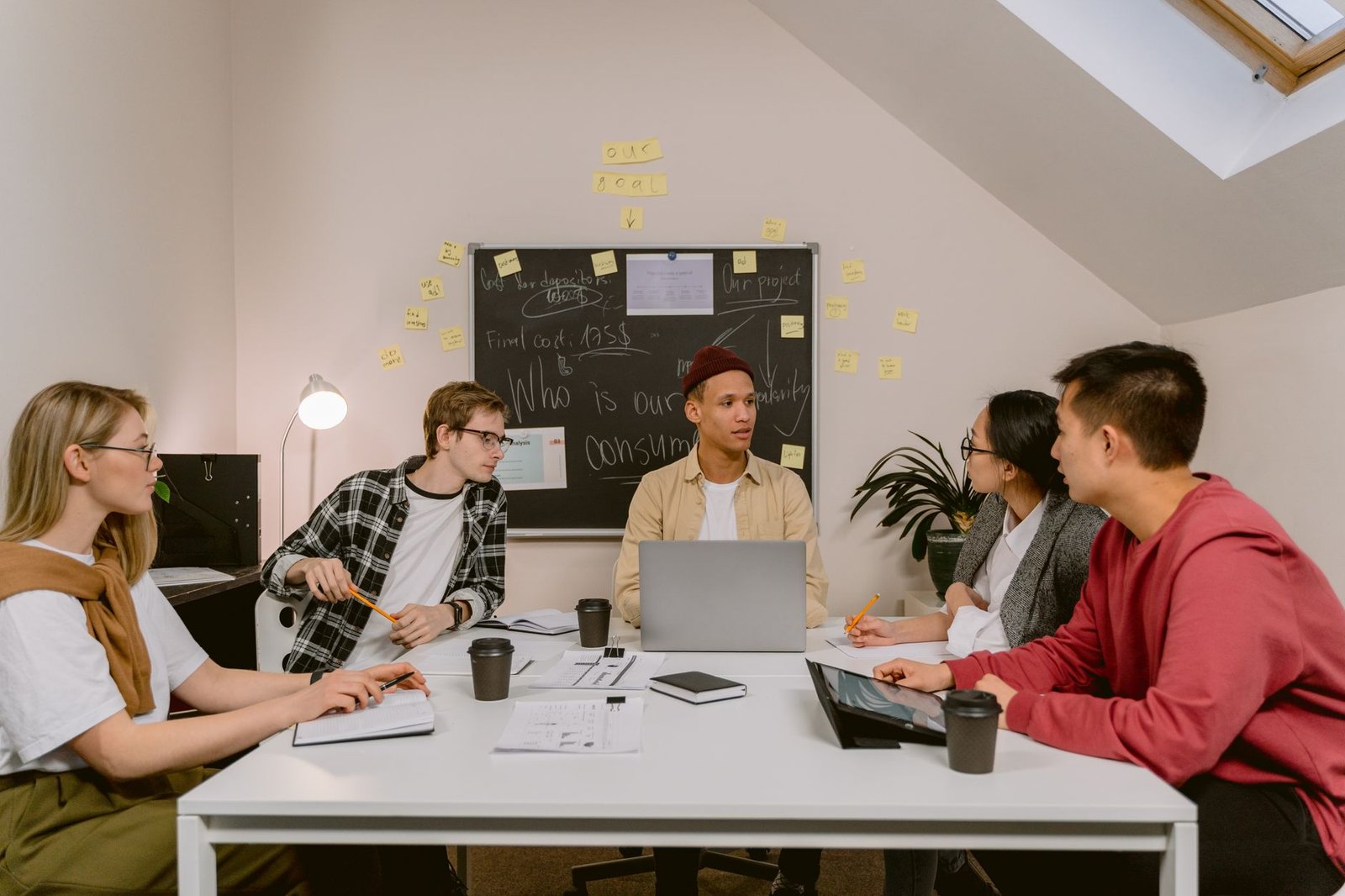 A group of students brainstorming ideas to start a debate club. — starting debate club