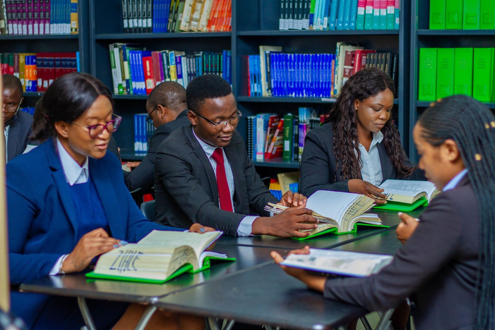 A group of students practicing their debate skills in a study session. — debate preparation