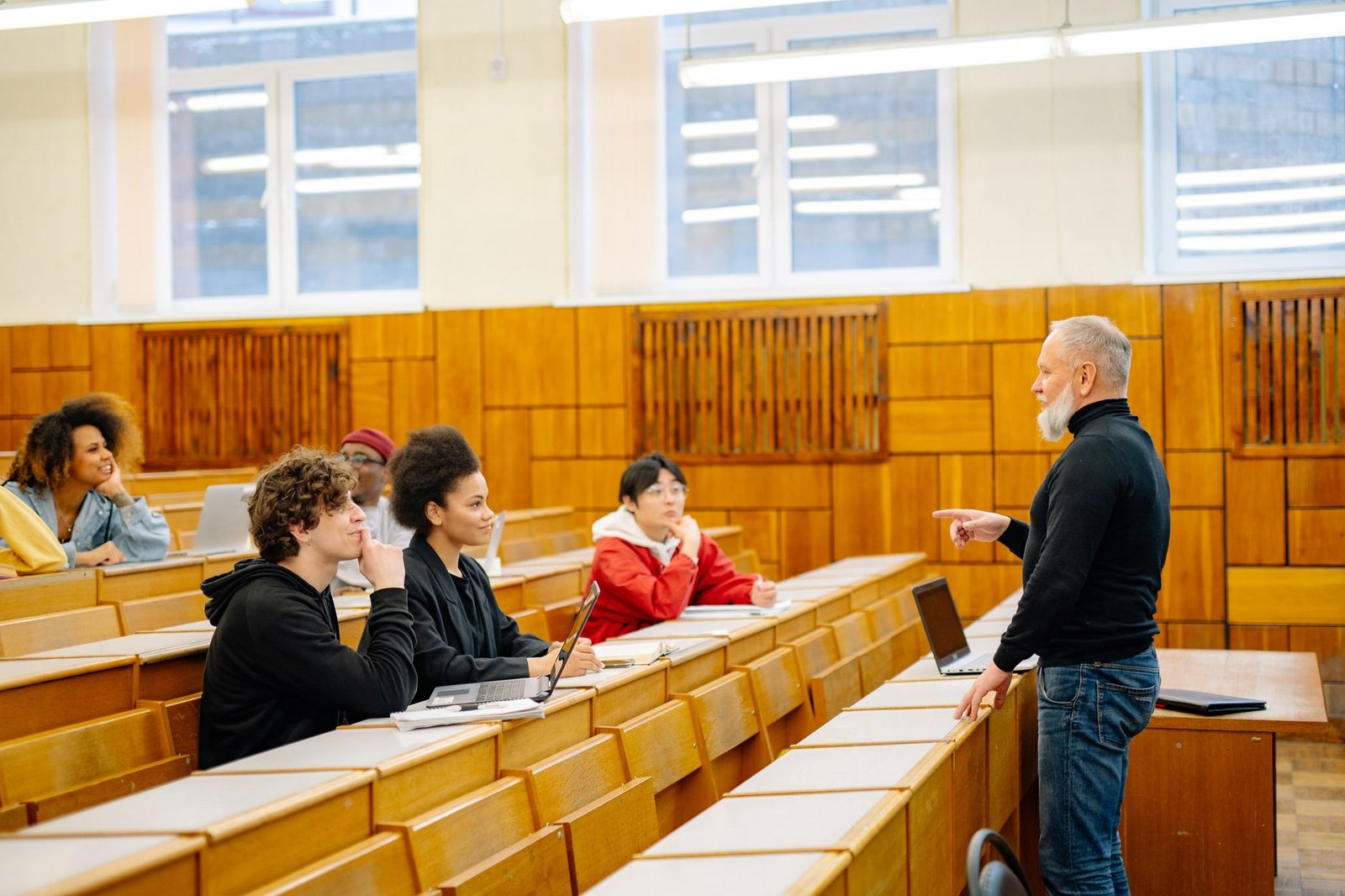 A group of university students participating in a debate, showcasing diverse opinions on free speech in academia.