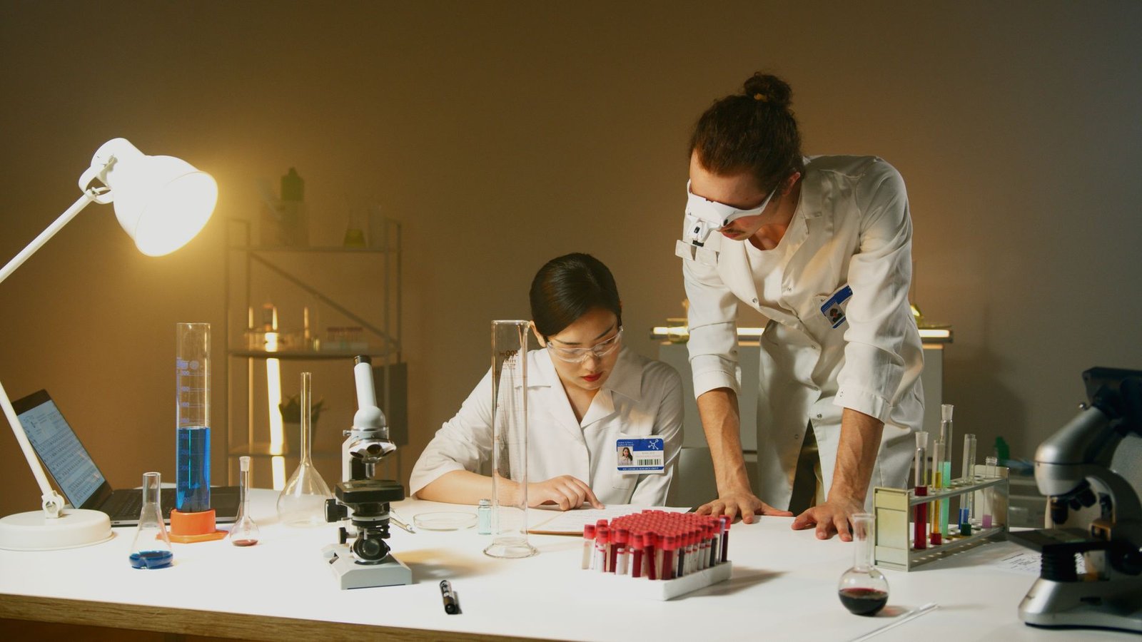 A laboratory setting showing scientists working with laboratory animals, illustrating the practice of animal testing debate.