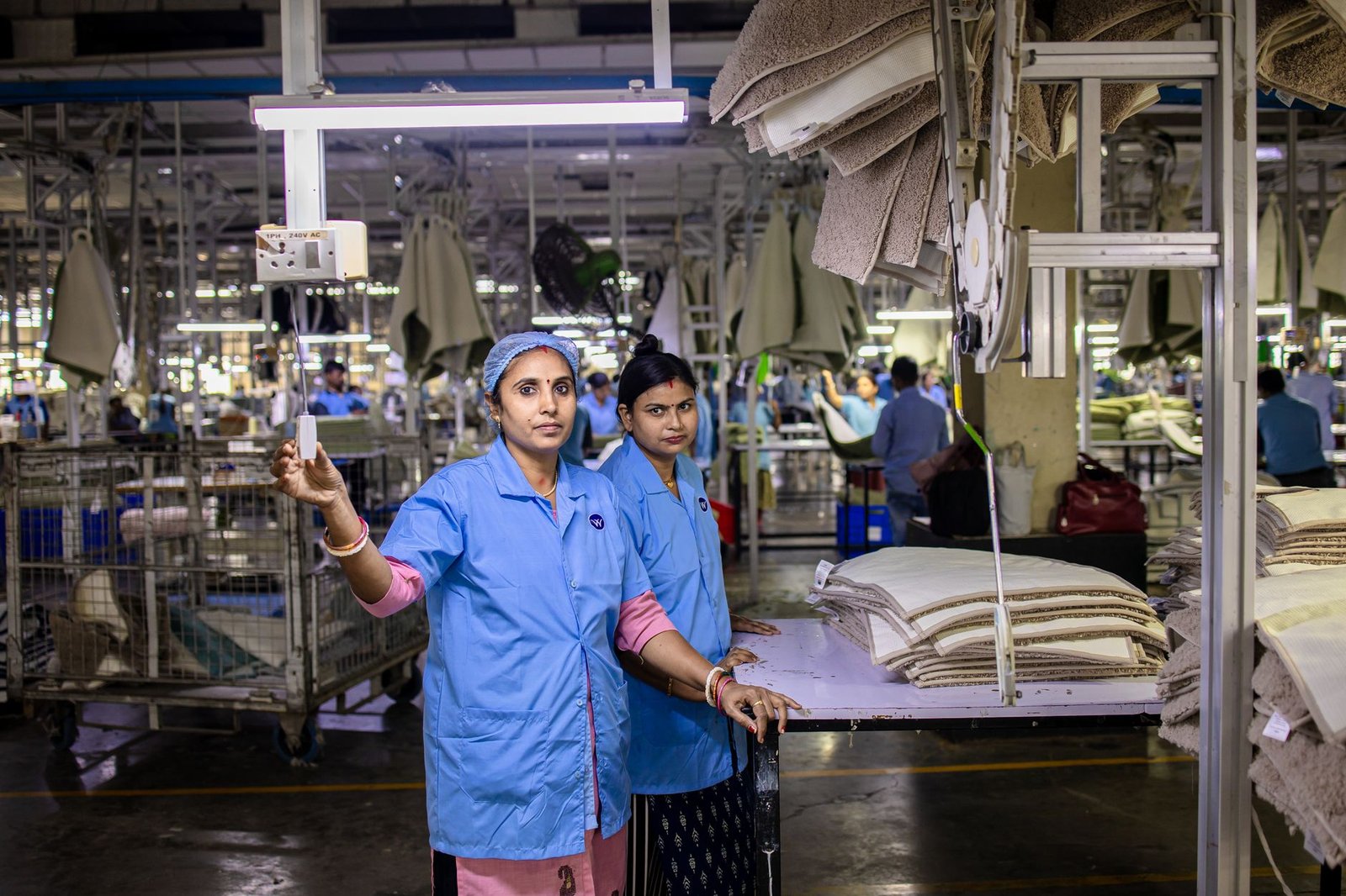 A photo depicting workers in a fast fashion factory, highlighting labor conditions. — fast fashion impact
