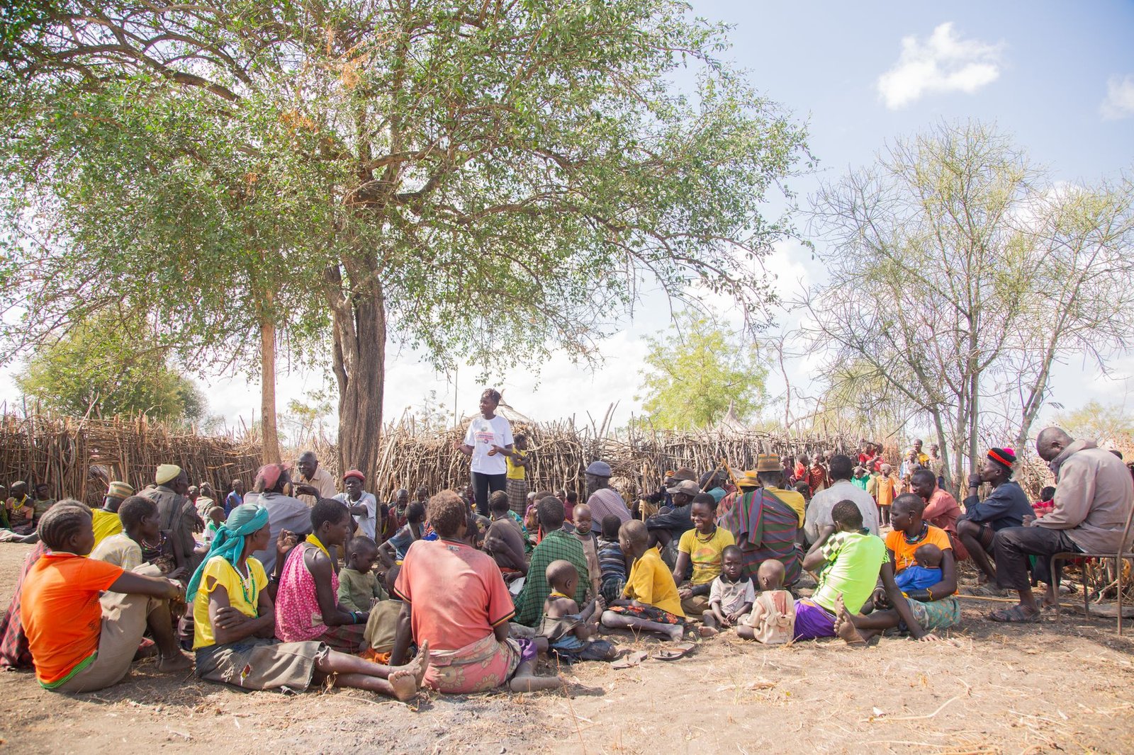 A photo of a community meeting discussing universal basic income and its implications for local poverty.