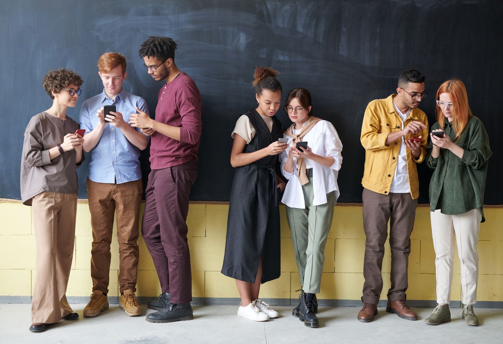 A photo of a diverse group of people engaging positively on social media in the context of the social media debate.