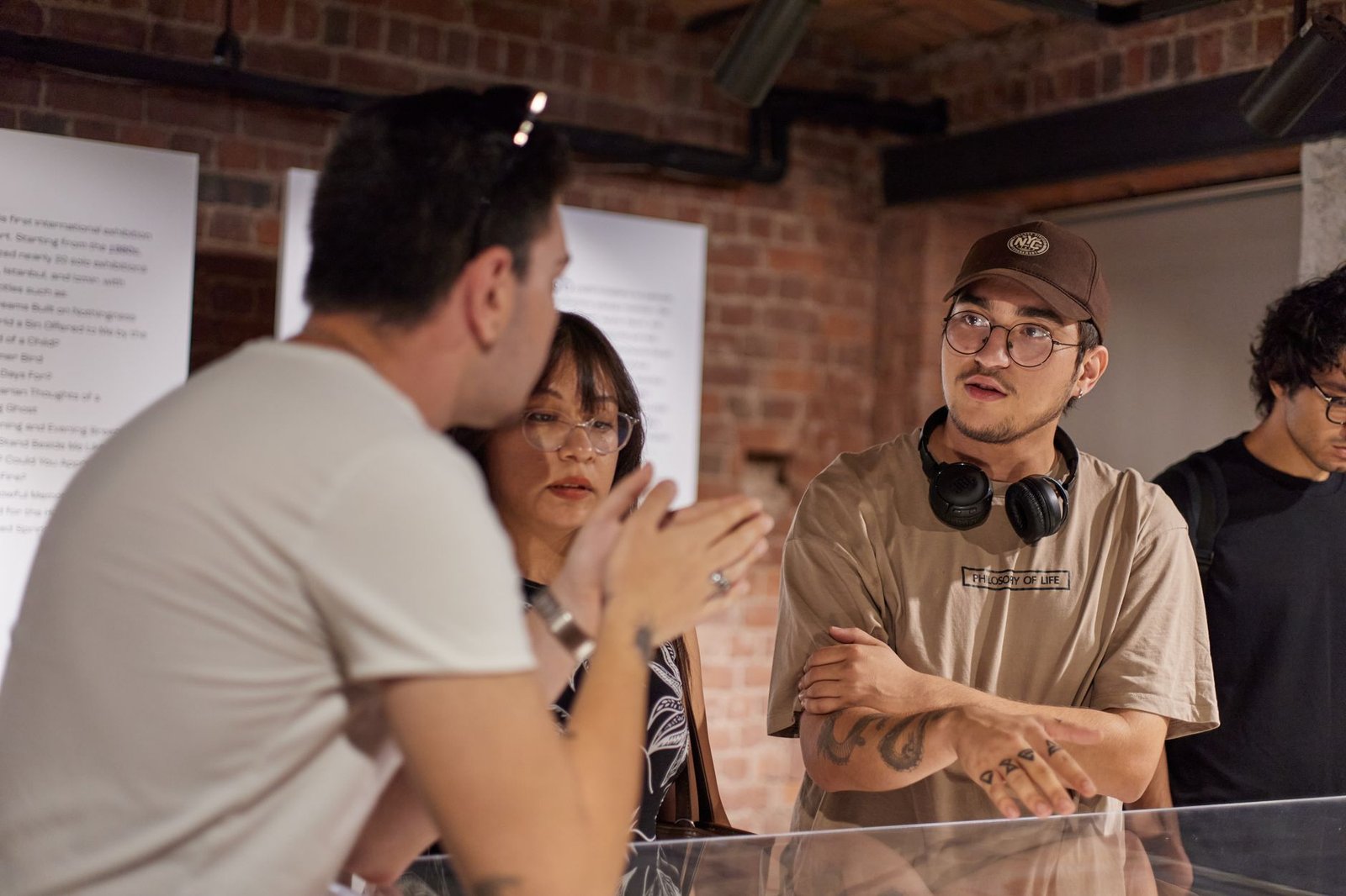 A photograph of a diverse group of people engaging in a debate, showcasing various cultural expressions. — cultural deba…