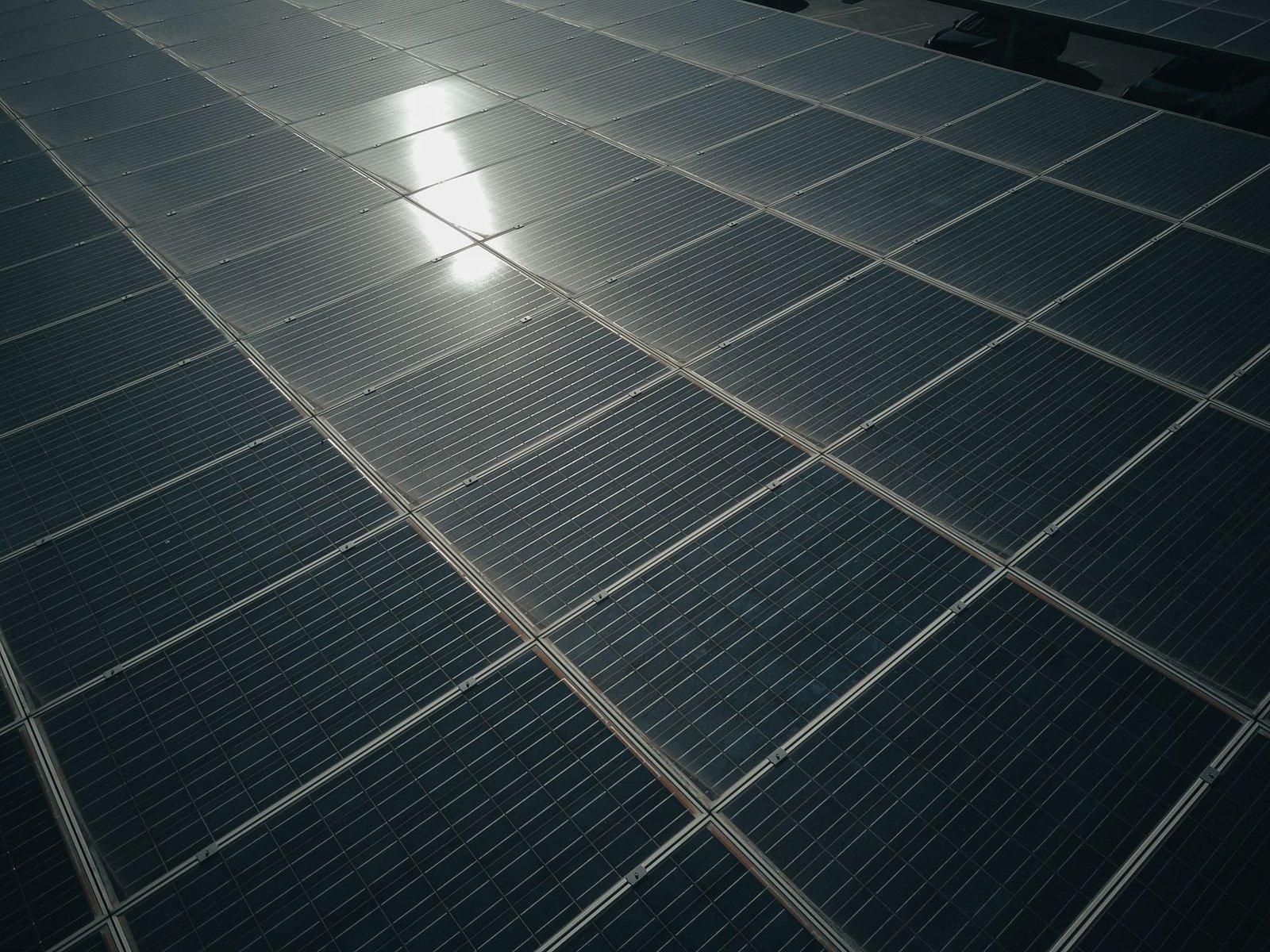 A solar panel installation showcasing sunlight absorption for energy generation. — renewable energy