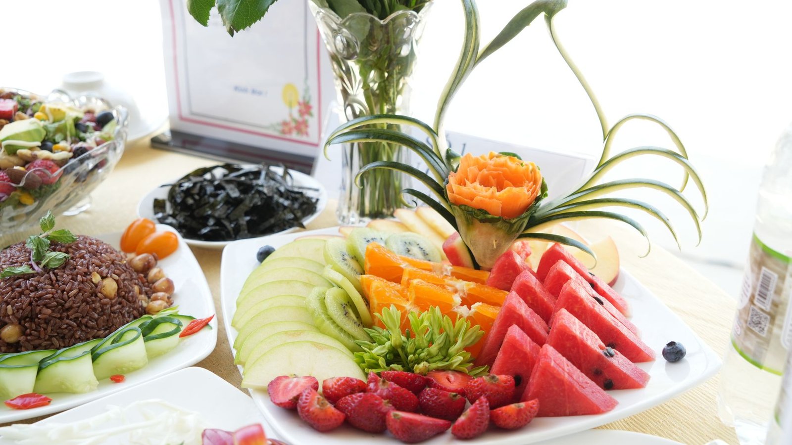 A vibrant plate of vegan food showcasing a variety of fruits, vegetables, and grains. — veganism debate