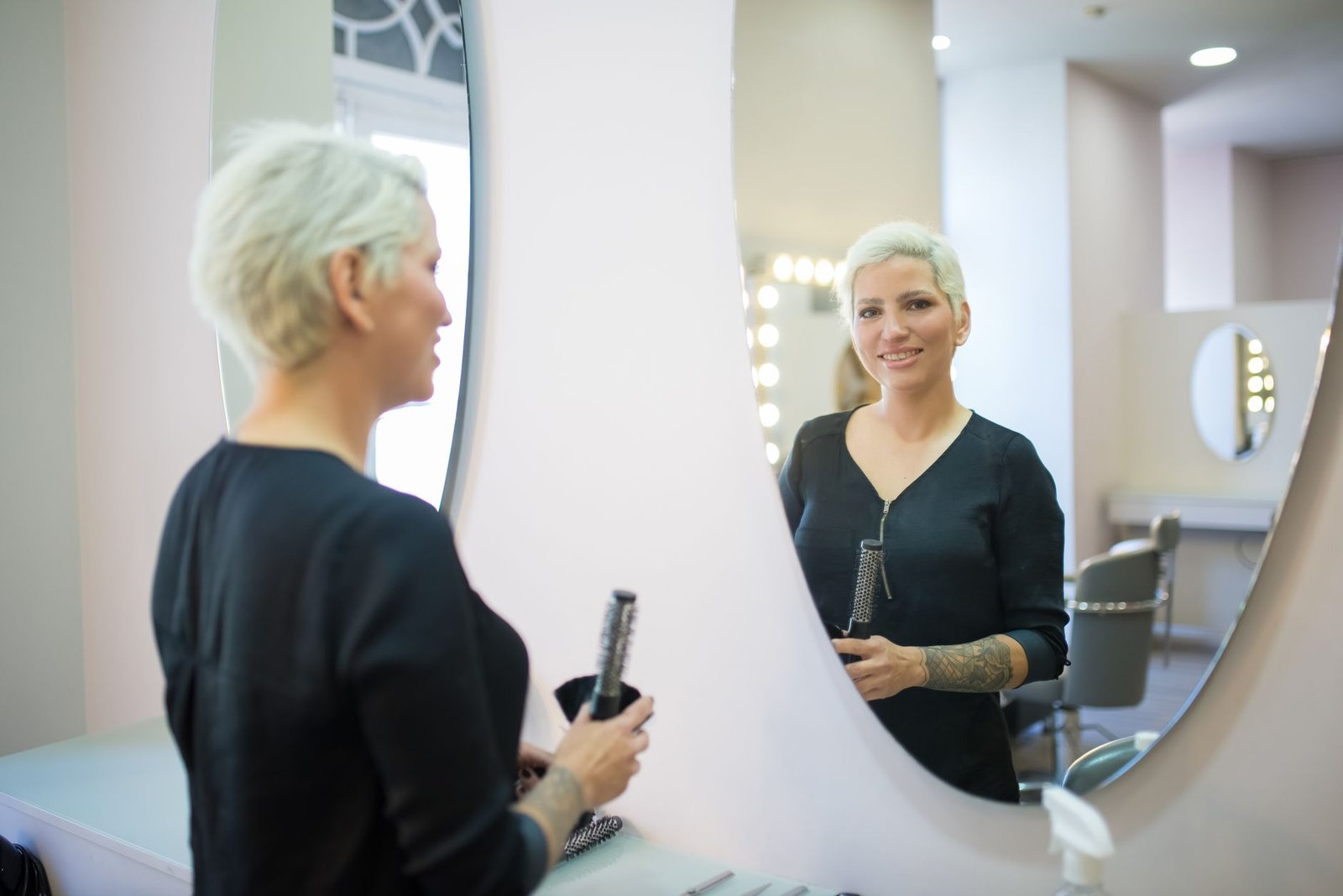 An individual practicing speaking in front of a mirror to improve delivery. — debate preparation