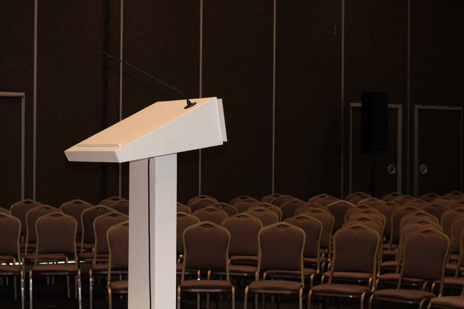 An organized debate setup with podiums and audience seating, highlighting the logistics of the event. — organizing mock …