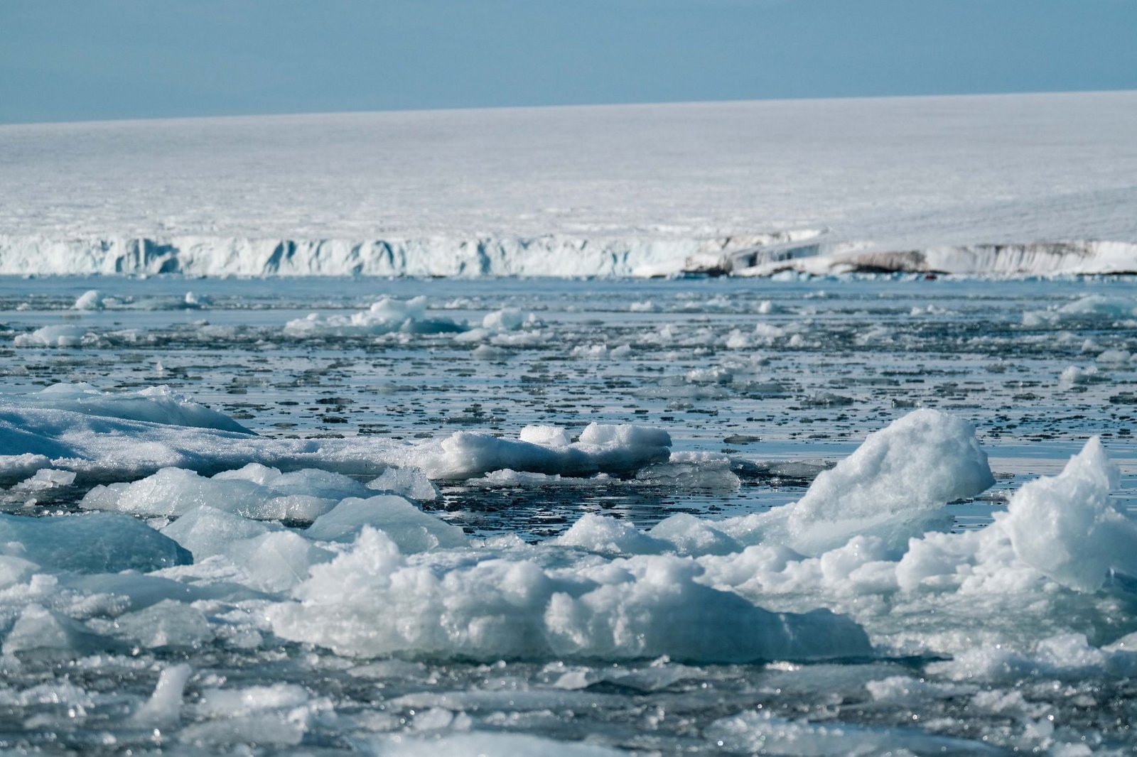 Illustration of melting ice caps and rising sea levels. — climate change debate