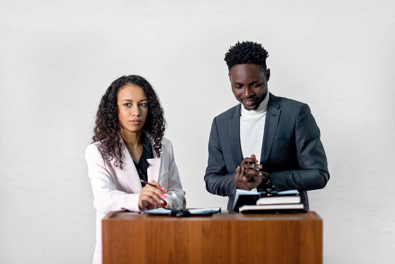 Photo of a public speaking practice session, showcasing techniques like body language and voice modulation during debate preparation.